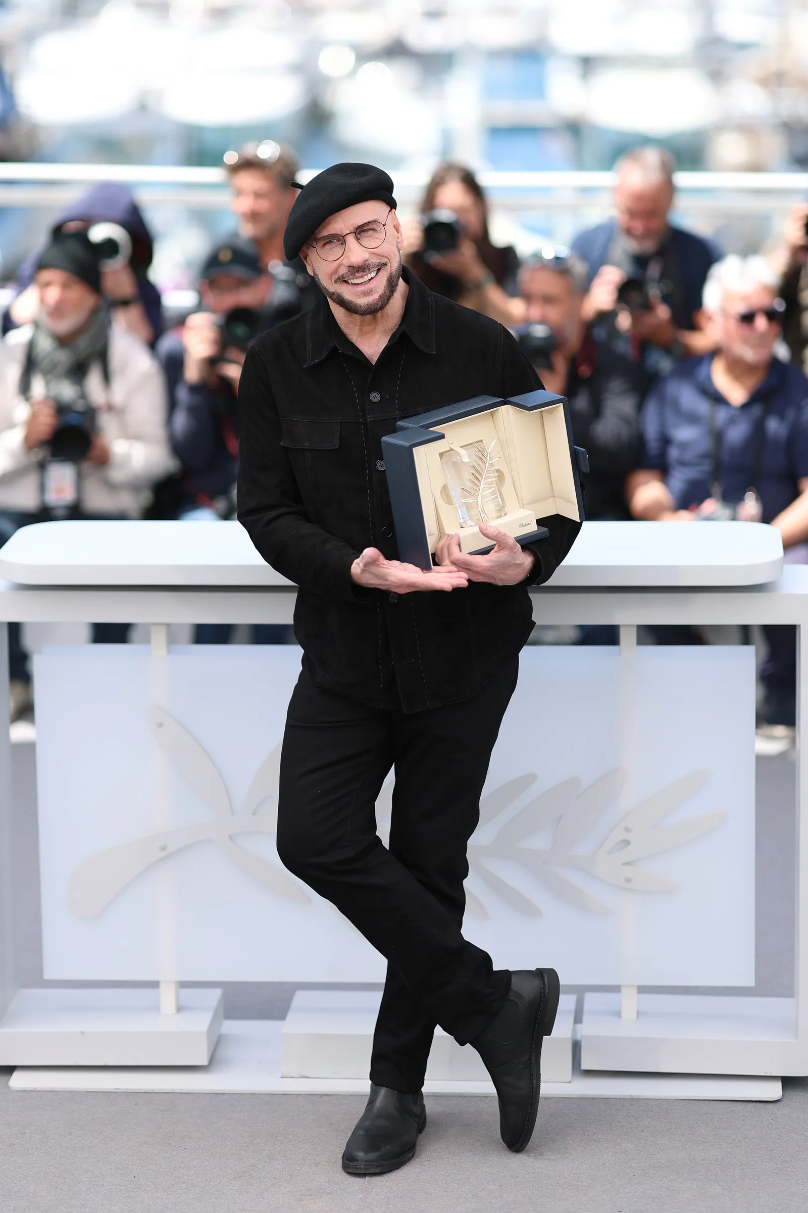 Cannes: Travolta's Bold Beret Statement 8