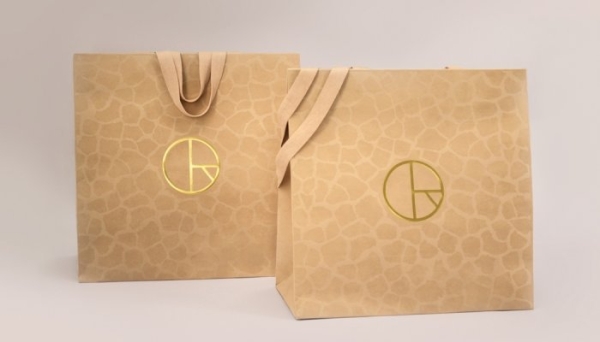 Rissmann: A prestige 100% paper bag with a suede effect and a sensual feeling